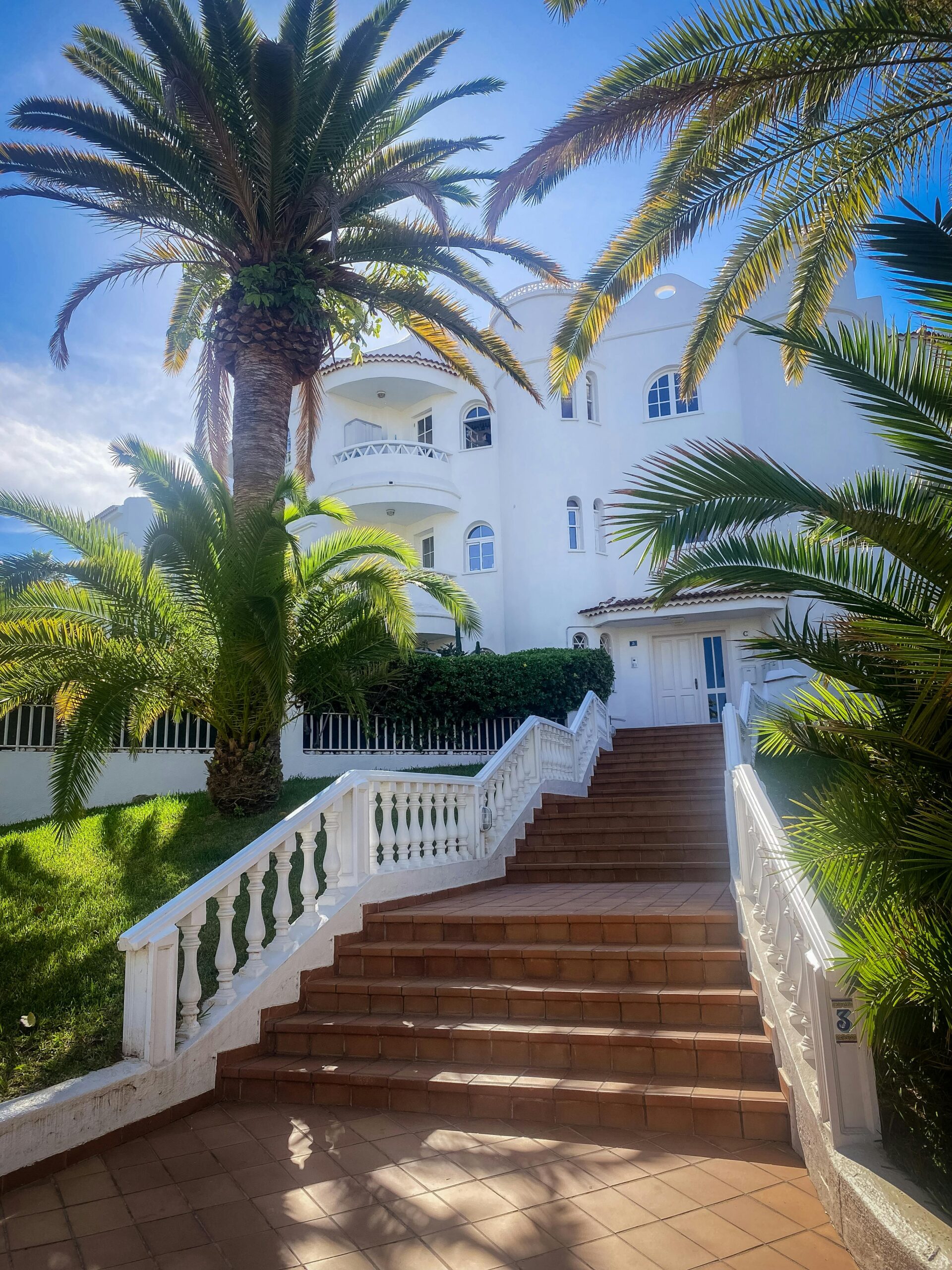 Elegant white villa with palm trees in Puerto de la Cruz, Canary Islands.