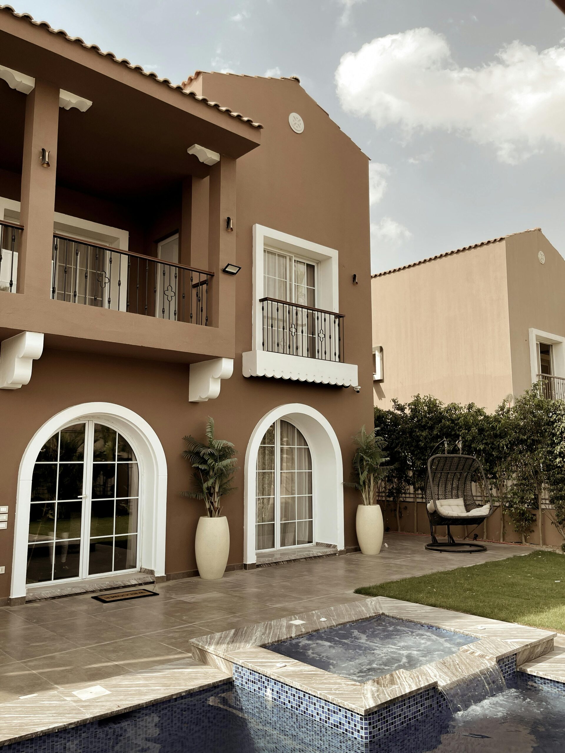 Explore this luxurious modern Mediterranean villa with a pool and elegant balcony.